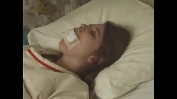 हॉट Pretty brunette in Straitjacket taped mouth tied to bed hospital बेहतरीन वीडियो